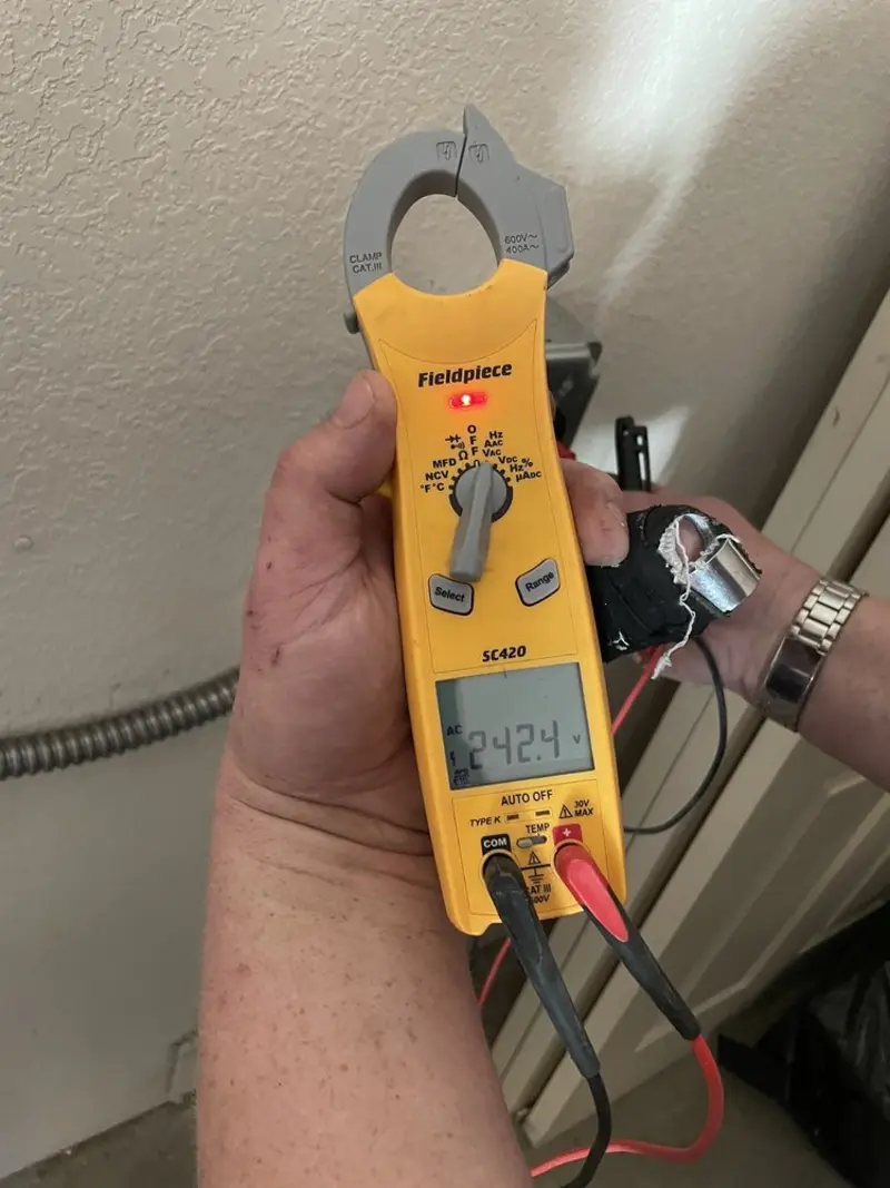 Voltage testing with clamp meter during Electrical Installation Services in Cocoa Beach